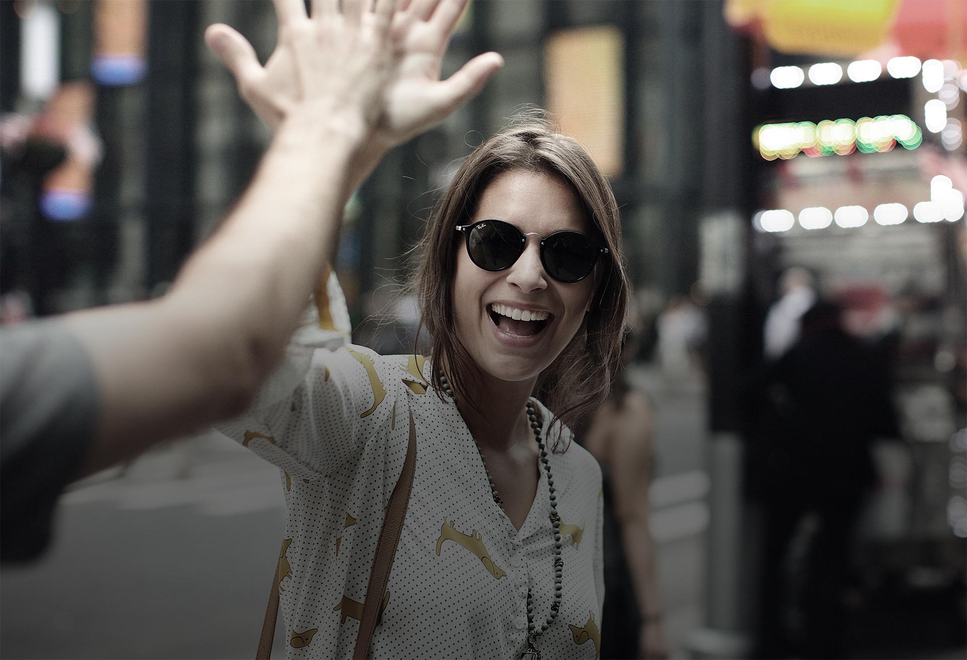 woman in sungalsses with a success high five